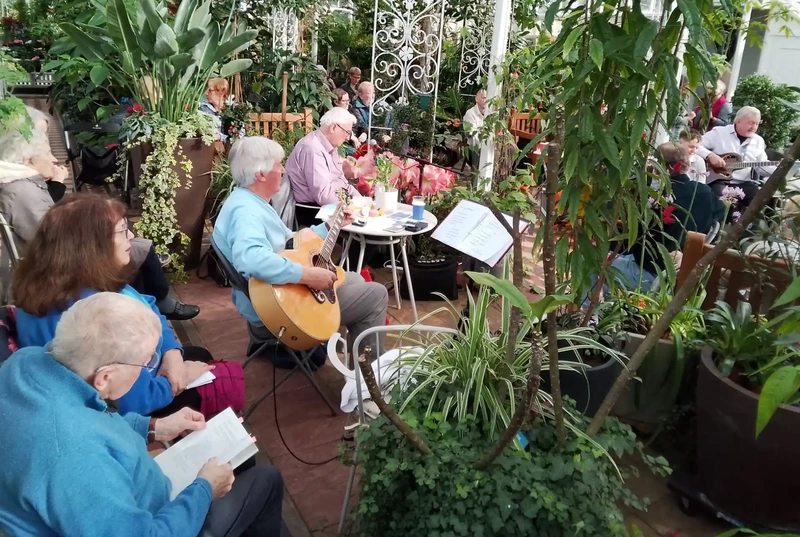 Musicians playing guitars in the Conservatory.