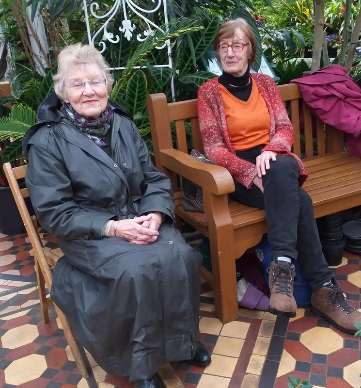 Two ladies enjoying live music in Conservatory